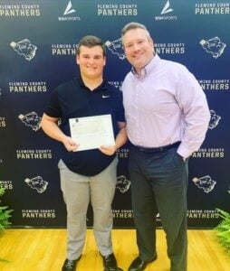 Photo of senior Dylan DeAtley, recipient of the 2nd Annual Hicks & Funfsinn Scholarship, standing with Joshua Daniel Hicks